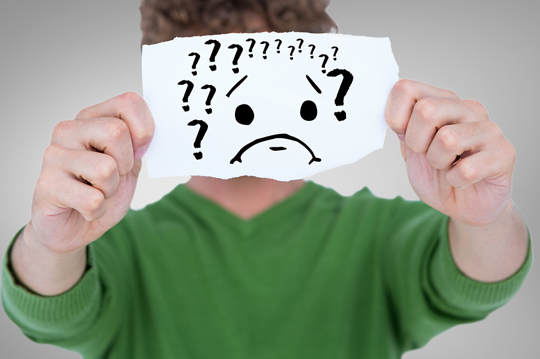man-with-piece-paper-with-question-marks